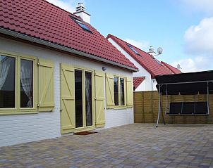 Spacious terrace of Holiday home Duinhoevelaan, Bredene-aan-Zee, perfect for relaxation on the Belgian coast.