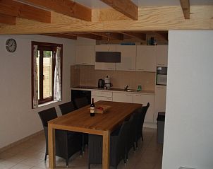 Modern kitchen in Holiday Home Duinhoevelaan, Bredene-aan-Zee, with spacious dining table and comfortable chairs.