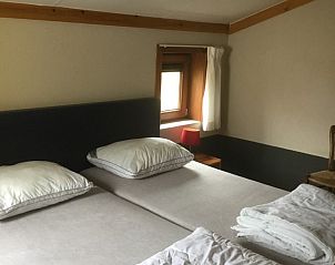 Cozy bedroom in Holiday Home Duinhoevelaan, Bredene-aan-Zee, with comfortable beds and restful atmosphere.