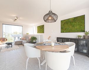 Stylish living room of Holiday Home Green in Bredene, Belgian coast, with modern decor and lots of natural light.