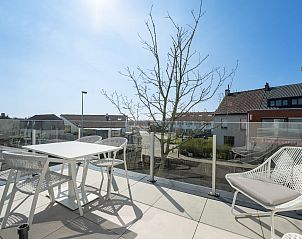 Enjoy the sunny terrace at Holiday Home Green in Bredene, Belgian coast. Perfect for relaxation and views of the surroundings.