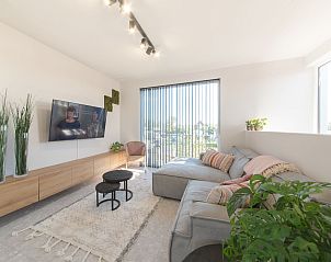 Bright living room of Holiday Home Green in Bredene, Belgian coast, with modern decor and garden views.