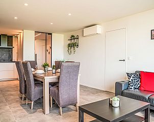 Stylish interior space of Apartment Astrid 68 in Bredene, Belgian coast, with modern dining room and comfortable sitting area.