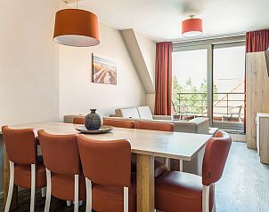 Stijlvolle binnenruimte van Familiesuite in Middelkerke, Belgische kust. Ideaal vakantiehuis voor gezinnen, met ruim terras en moderne inrichting.
