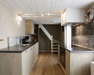 Modern kitchen in De Zeester apartment Ostend, Belgian coast with wooden details.