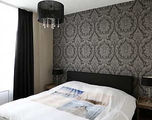 Bedroom with double bed in De Zeester apartment in Ostend, Belgian coast.