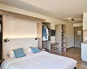 Modern interior space of Accessible studio | 2p by the sea, Belgian coast, Belgium with comfortable furnishings.