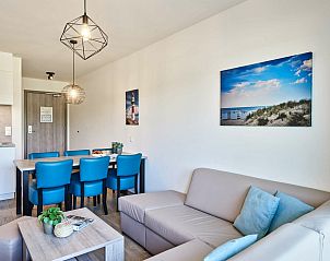 Garden view veranda in Family suite by the sea, Belgian coast, inviting vacation home.