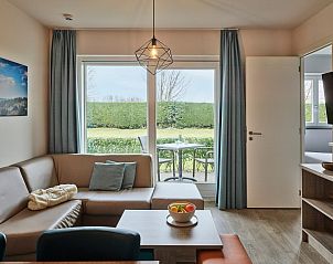 View of playground from Family suite by the sea, Belgian coast, family-friendly vacation home.