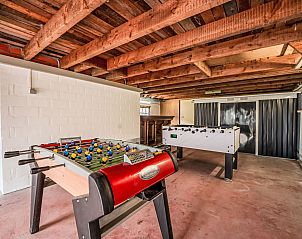 Game room in Holiday Home Dunezwin, De Haan, Belgian coast, with table football tables for relaxation and fun during your stay.