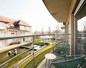 Genieen Sie die Aussicht vom Balkon des Apartments Green Garden in De Haan an der belgischen Kste, ideal fr einen entspannten Urlaub.