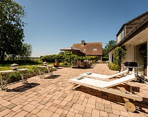 Enjoy the sunny garden at Holiday Home Villa Rosetree with sauna and pool table in De Haan on the Belgian coast.