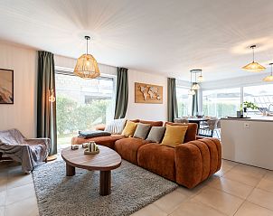 Vakantiehuis Casa Pepino in De Haan, Belgische kust, biedt een charmante buitenruimte met terras en groene tuin voor ontspanning.