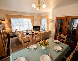 Cozy living room in Holiday home Hamarrb with dining area, De Haan, Belgian coast. Comfortable vacation home with garden and parking.