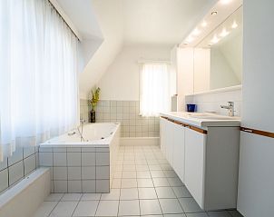 Bright and spacious bathroom in Holiday home Hamarrb with garden and parking, located in De Haan on the Belgian coast, ideal for relaxation.