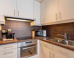 Cozy living room of Apartment Casa Blanca in De Haan, Belgian coast, Belgium, with modern decor and lots of natural light.