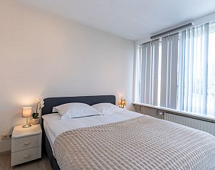 Modern kitchen in Apartment Casa Blanca, De Haan, Belgian coast. Spacious interior space with light cabinets and stylish decor.