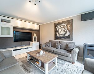 Cozy living room in Holiday Home Il Passimento in De Haan, Belgian coast, with comfortable seating area and modern amenities.