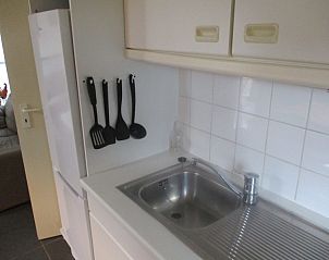 Functional kitchen of De Haan Cottage 670, vacation home in De Haan, Belgium, with modern amenities.
