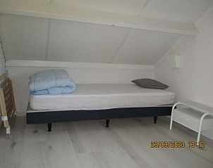 Colorful bedroom in De Haan Cottage 670, vacation home in De Haan, Belgium, with fresh interior.