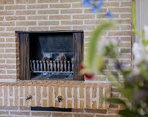 Authentic fireplace in La Maison Fleurie vacation home in Koksijde, Belgian coast for cozy evenings.